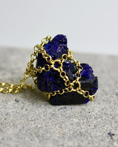 Elevate Your Style and Make a Statement in This Unique Caged Azurite Necklace
