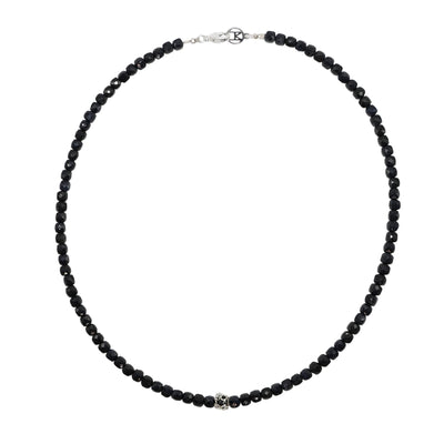 Black beaded sapphire gemstone necklace on a white background